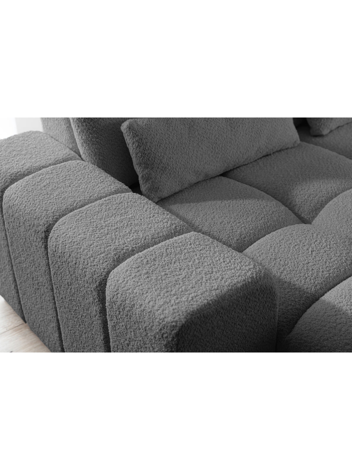 Rohová sedačka Magnelio L pravostranná šedá boucle detail sedáku